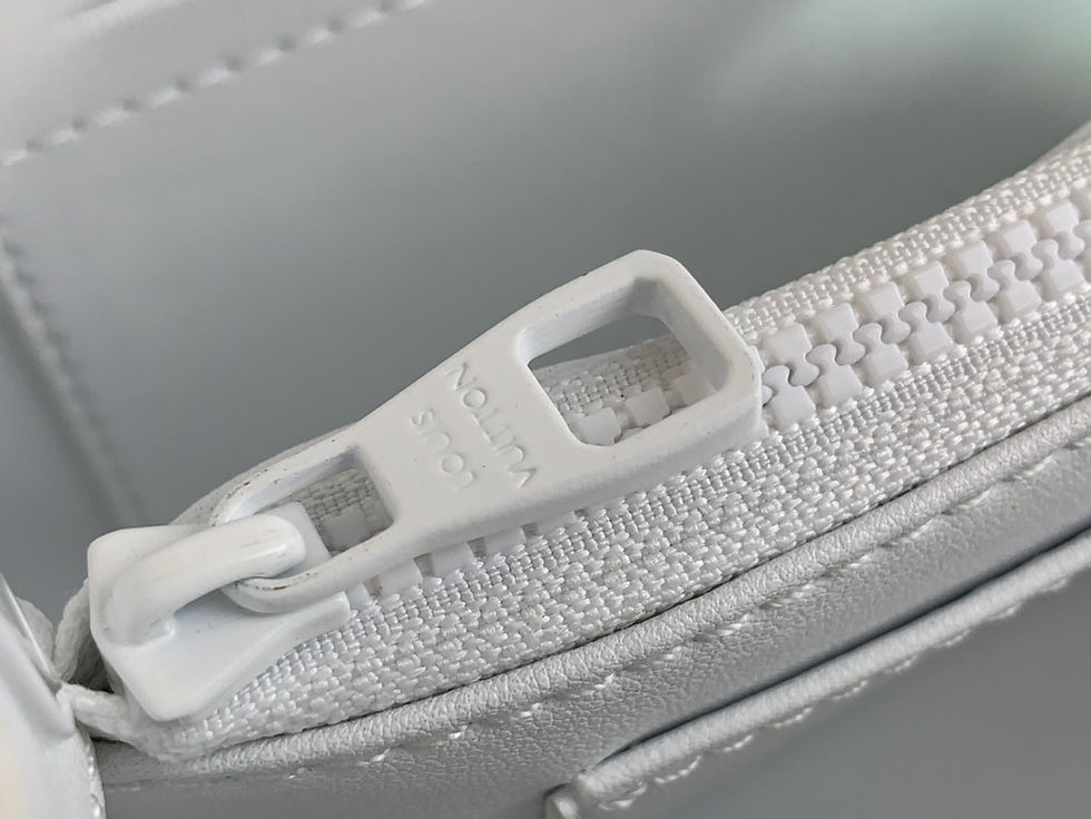 Close-up of white Louis Vuitton zipper – Luxe Vault NYC