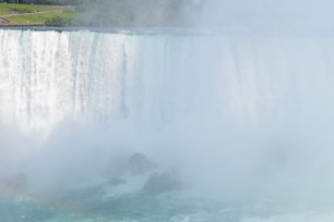 a waterfall with a lot of smoke coming out of it