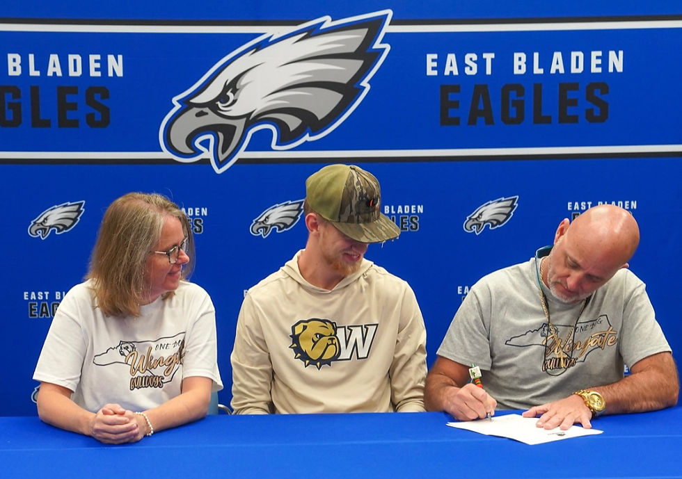 Cole and his parents, Chris & Mandy Butler, as he officially signs.