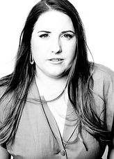 A black and white head shot of a woman looking at camera. Headshot and personal branding photography in Mackay