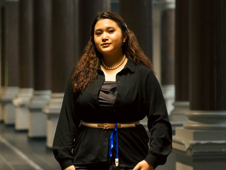 Kamila Batavia standing inside Technische Universität Berlin as a professional guest speaker