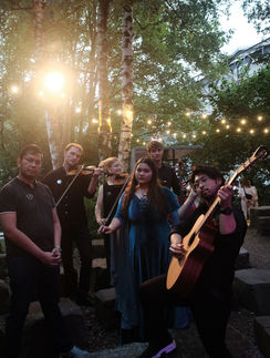 Kamila Batavia performing with band and string musicians during Hurled to the Moon at Kampnagel International Summer Festival 2026.