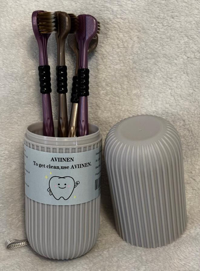 Thumbnail: Three-sided toothbrush with holder