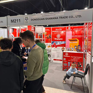 SHAMANA Sourcing booth at AES PTAK Expo Warsaw 2025 – front view with visitors in the electronics and appliances zone.