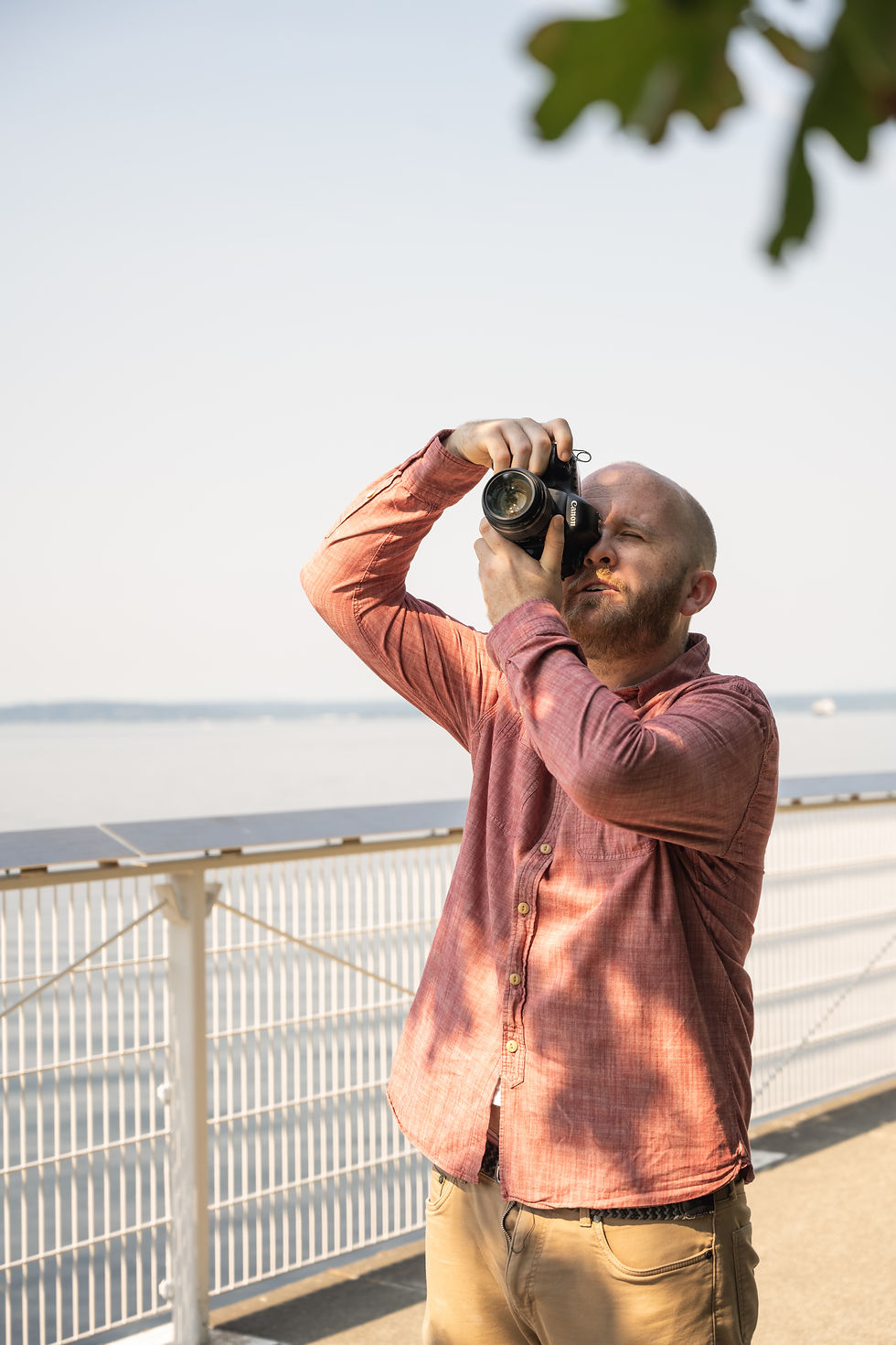 Photographer capturing his origin story by the water.