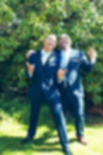 Armand and a groomsman in a fun wedding portrait.