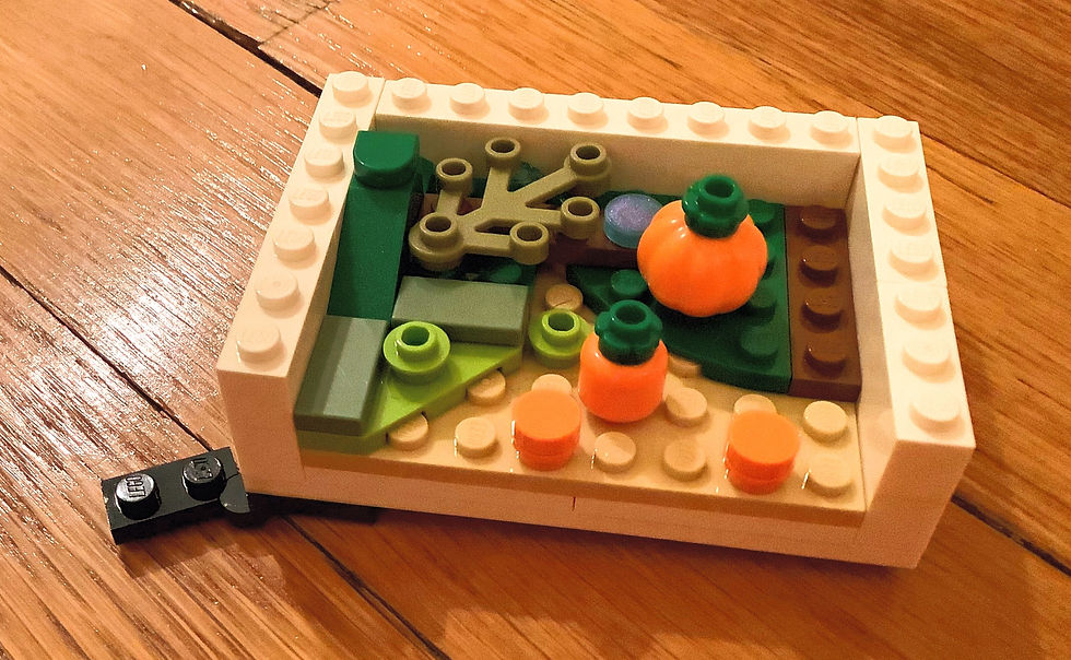 LEGO pumpkins with LEGO grass and LEGO leaves, with bits of LEGO dirt, LEGO pumpkin picking season, LEGO fall, LEGO October, LEGO calendar