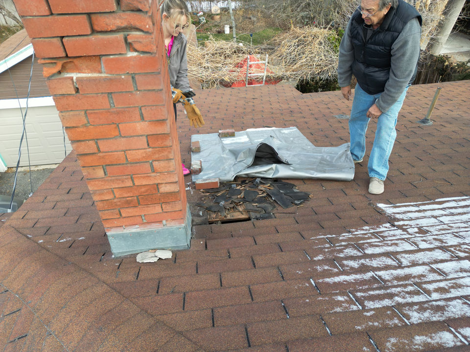damaged asphalt roof in utah residential home