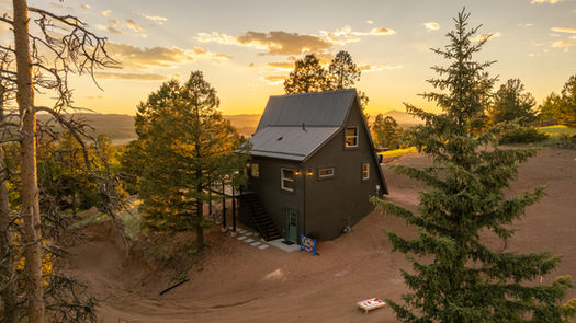 A-Frame cabin with large windows and mountain views built in Teller County, Colorado by Rocky Mountain Developers
