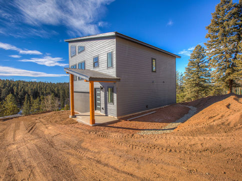 Exterior of modern mountain home in Teller County, Colorado with clean lines and large windows.