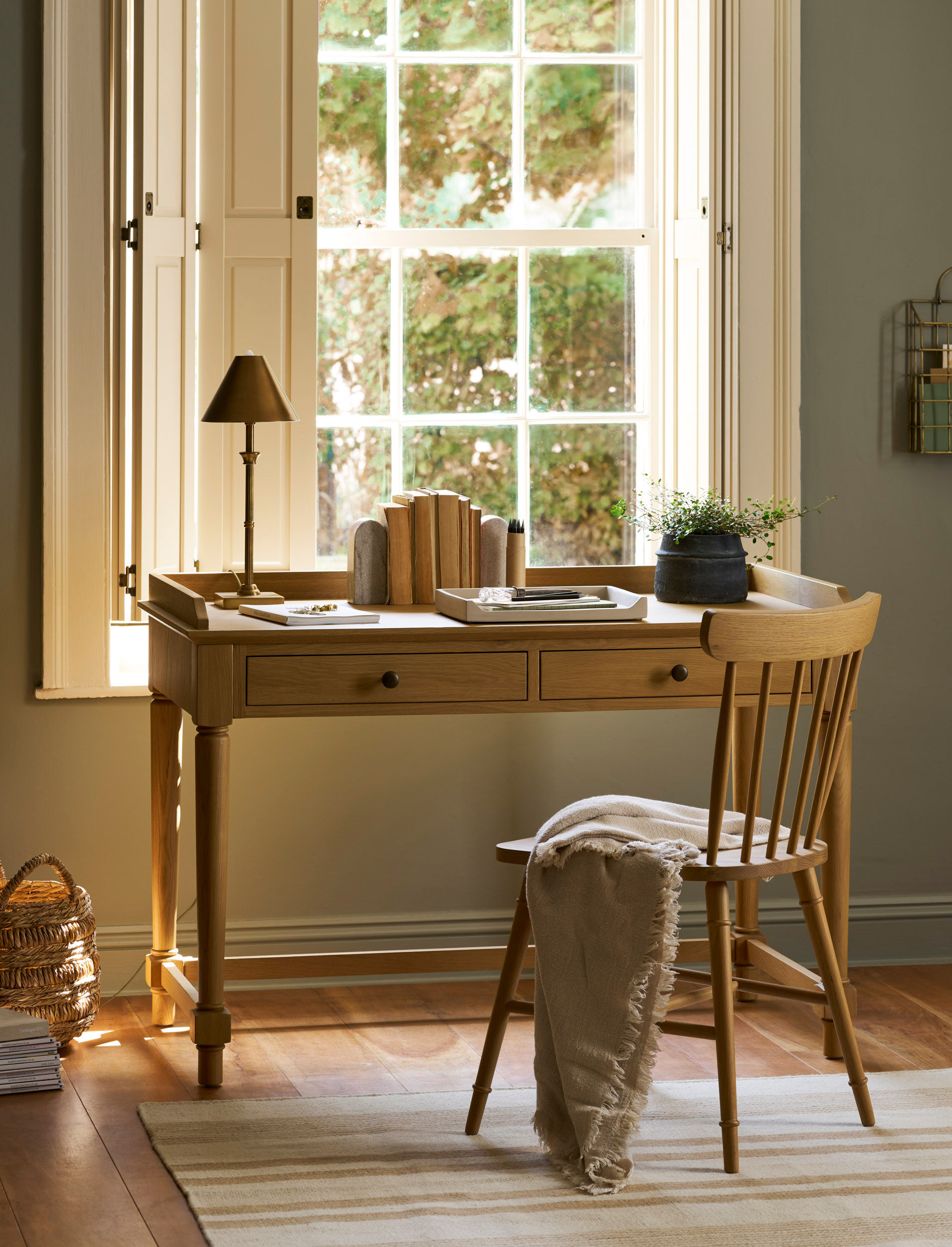 Garden Trading Oakworth oak desk with two drawers positioned in a bright home office setting