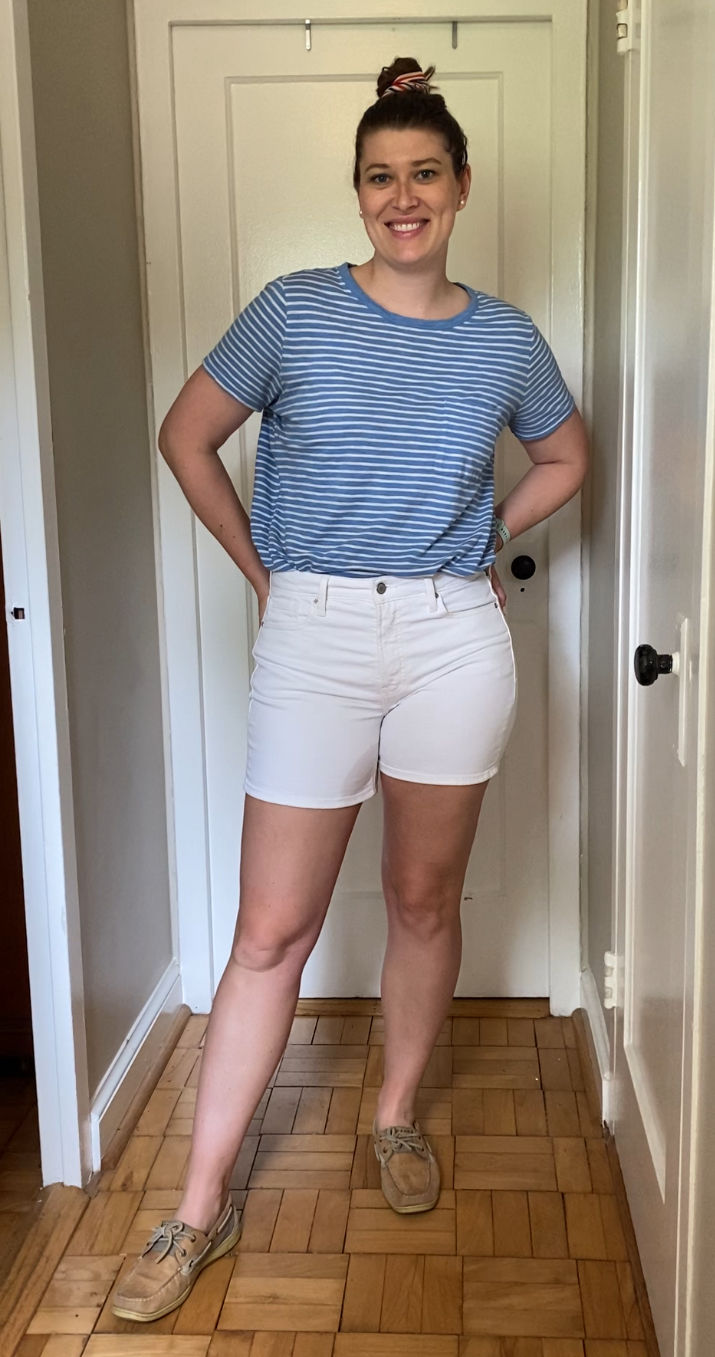outfit with a blue and white striped t-shirt, white shorts, Sperry boat shoes, and American flag hair scrunchie 