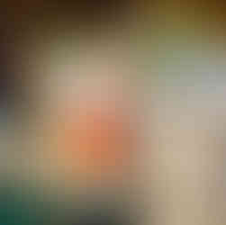 A red cocktail on a green table.