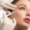 A specialist does a neuromodulator injection on a woman’s face.