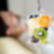 Image of fruits in a bag hanging, representing nutrients.