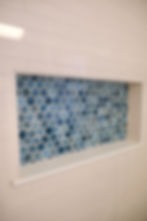 Blue hexagonal tile shower niche in portfolio bathroom