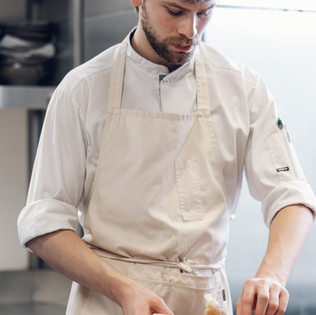 Head chef preparing vegetarian food at Fine Dining restaurant Zoe in Bern.