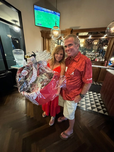 Brian and Jamie Cusick bid highest for the VIP tailgate experience.