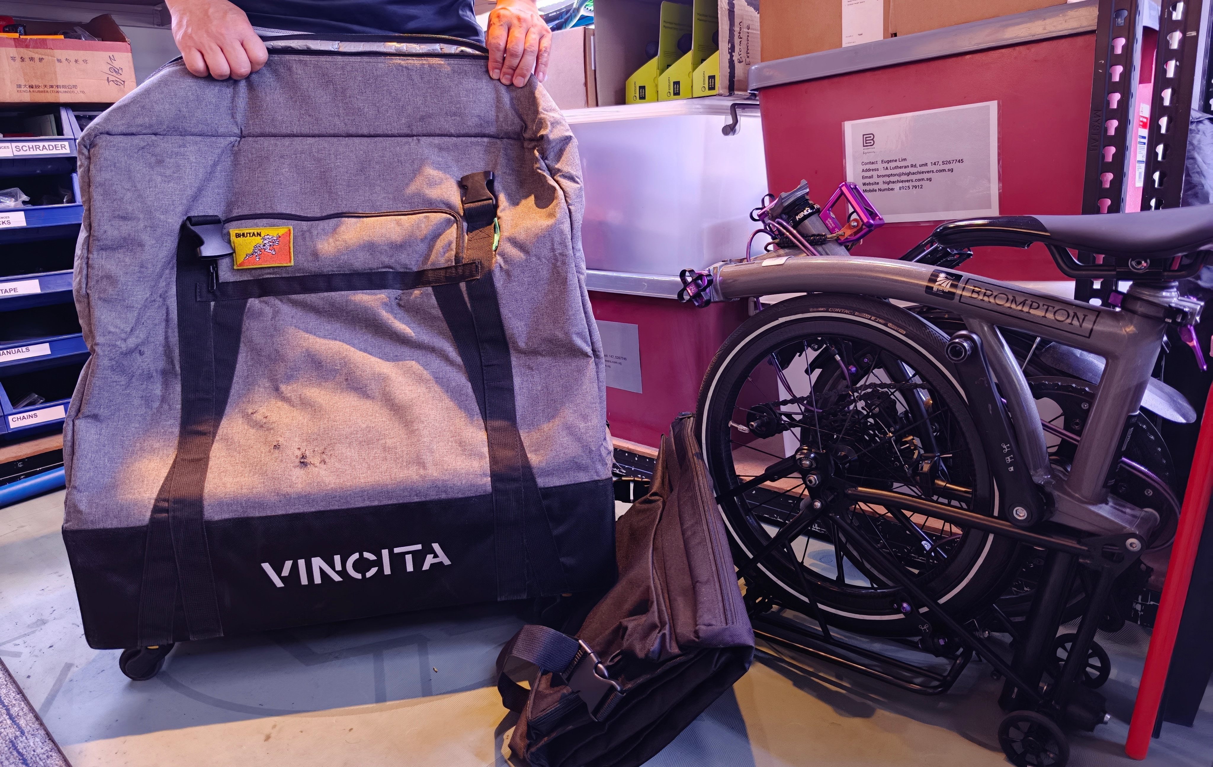 Vincita soft case near a dark grey brompton bike