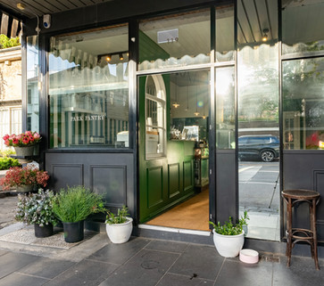 Park Pantry storefront, styled with plants and flowers