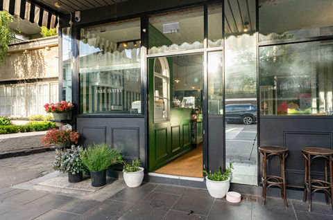 Park Pantry storefront, styled with plants and flowers