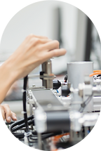 Photo showing the assembly of siren components, with technicians working on precise fittings and connections