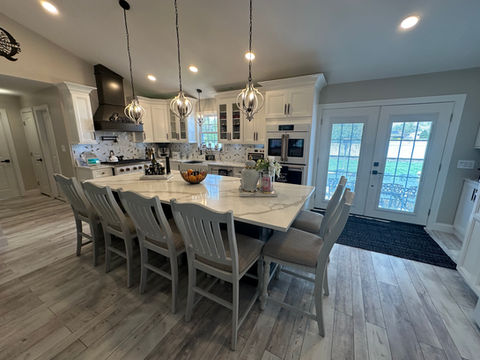 This beautiful home located in Old Bridge, NJ opted for the Fabuwood Onyx in frost and cobblestone with the beautiful Calcatta Gold Quartz countertop accentuated with the vein matching waterfall.