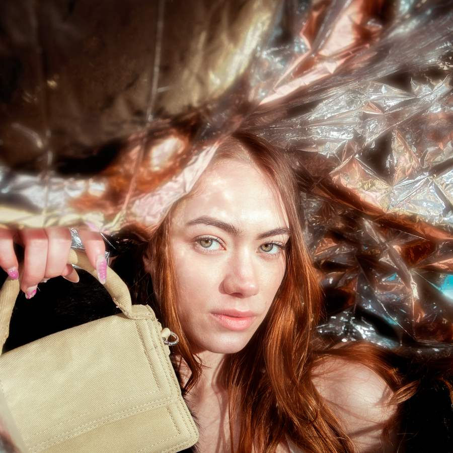 Aurora Vizor framed by crumpled silver with a neutral bag – A brighter kind of armour by Rowan Freeman for MALVIE Magazine