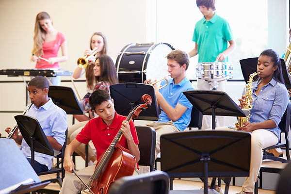 Pupils Playing Musical Instruments In School Orchestra.jpg