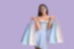 Happy beautiful young woman with shopping bags on lilac background.jpg