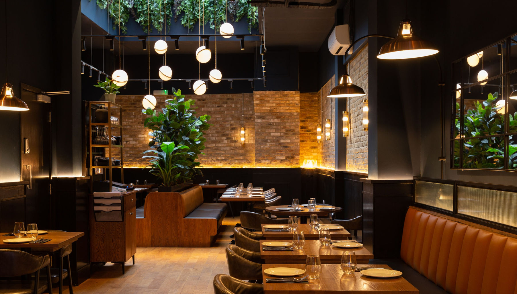 Interior Design London, skylight, feature light, fake plants, dark wood, exposed bricks