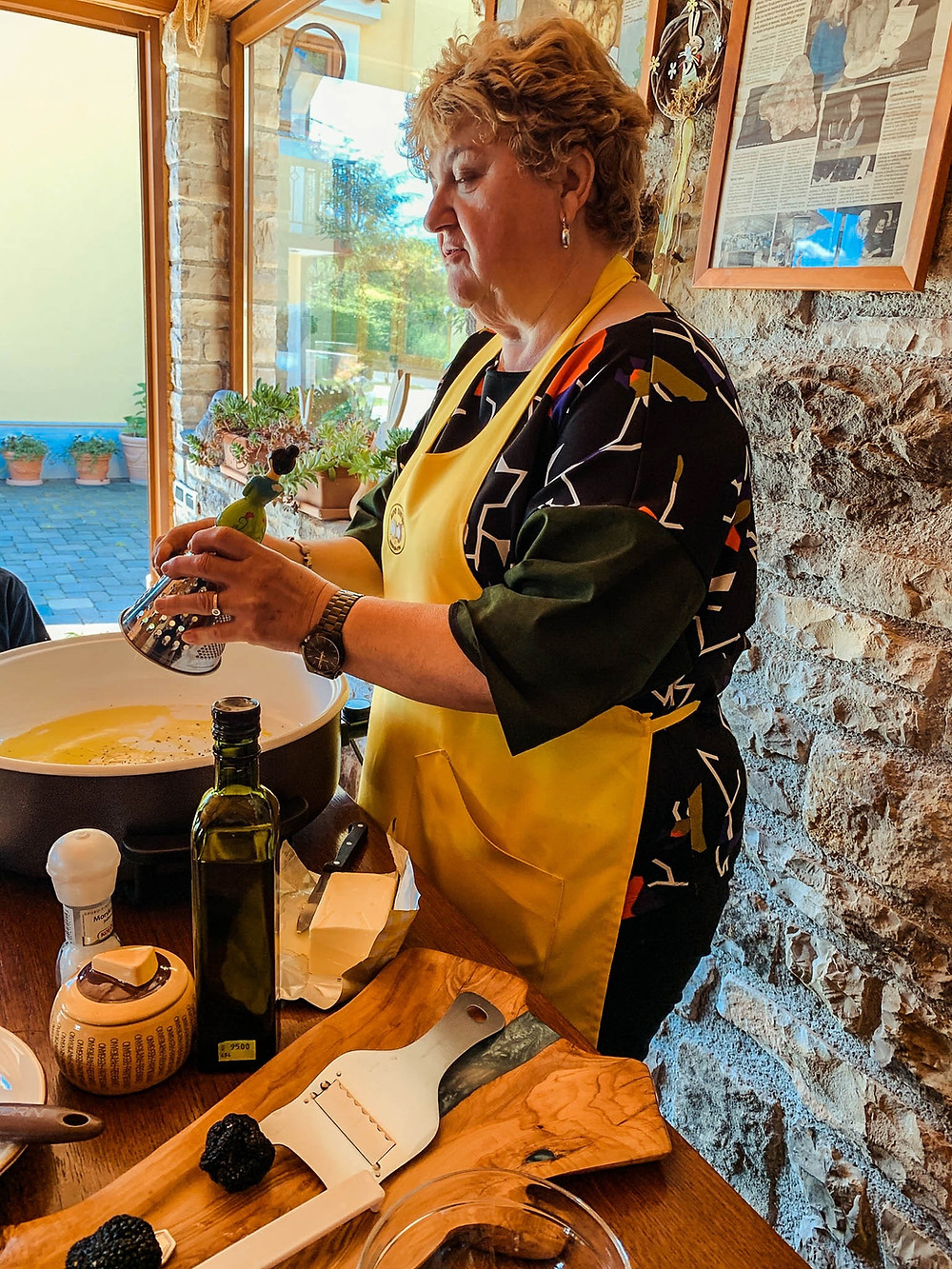 Miro Tartufi's wonderful hostess and chef - "action shot" over some truffle scramble eggs