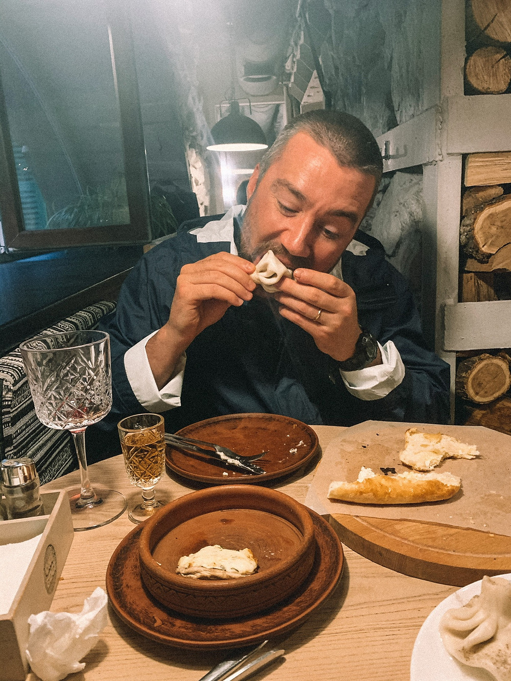 Chipp enthusiastically eating a khinkali