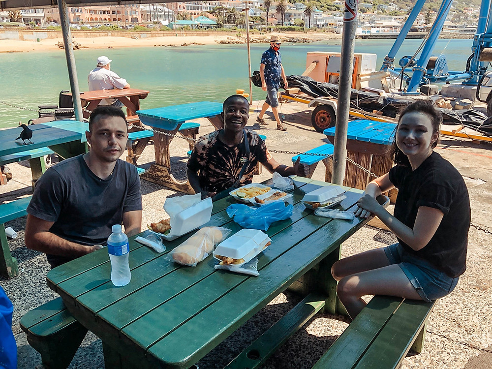 Enjoying some delicious food at Kalky's with our guide, Yanga, and a fellow tourist