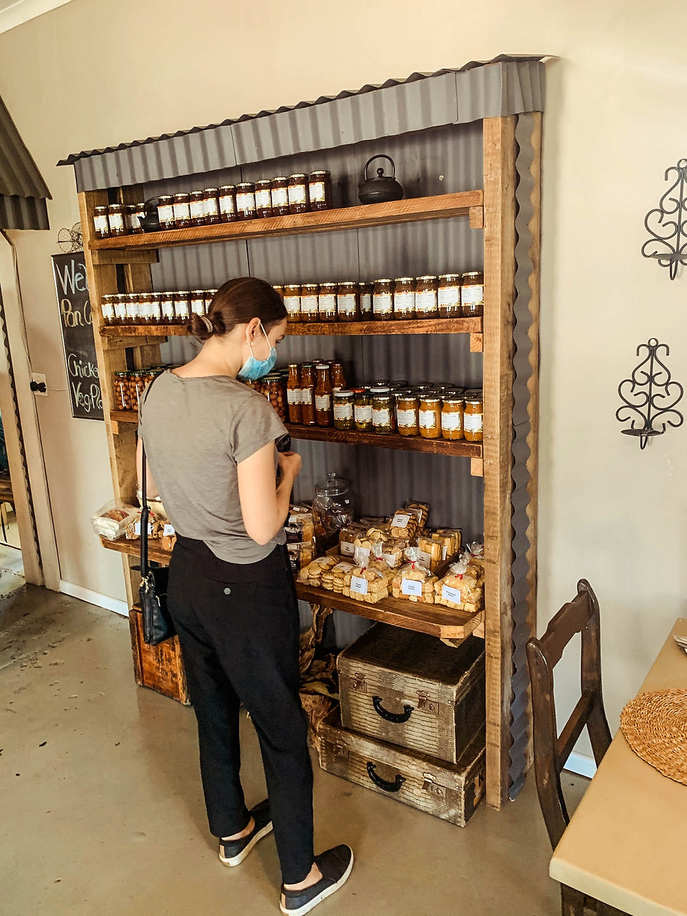 Looking over the restaurants delicious selection of local jams, sauces, and spices for sale