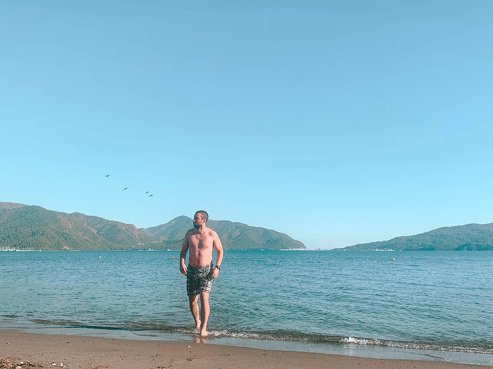 Paparazzi finally captured the casually-getting-out-of-the-water shot...