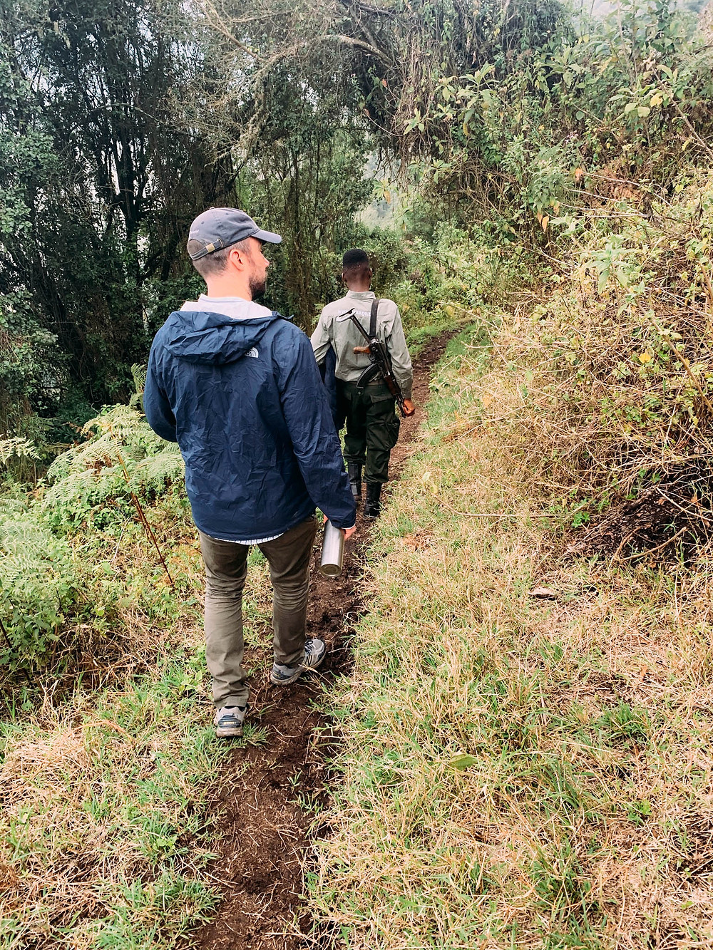 Descending into Empekaai Crater - armed ranger a necessary precaution