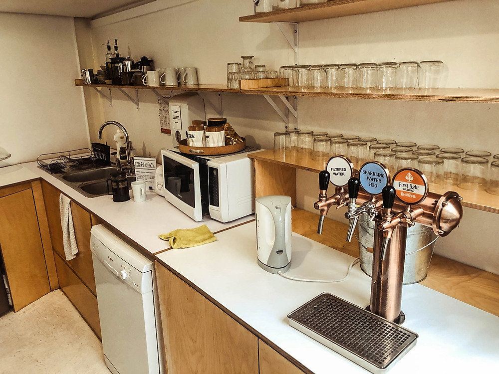 Notice the plunger/French press by the sink...