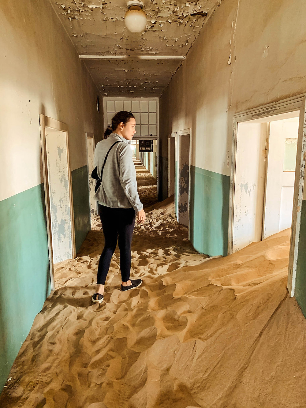 Sand piling up in Kolmanskop's former hospital