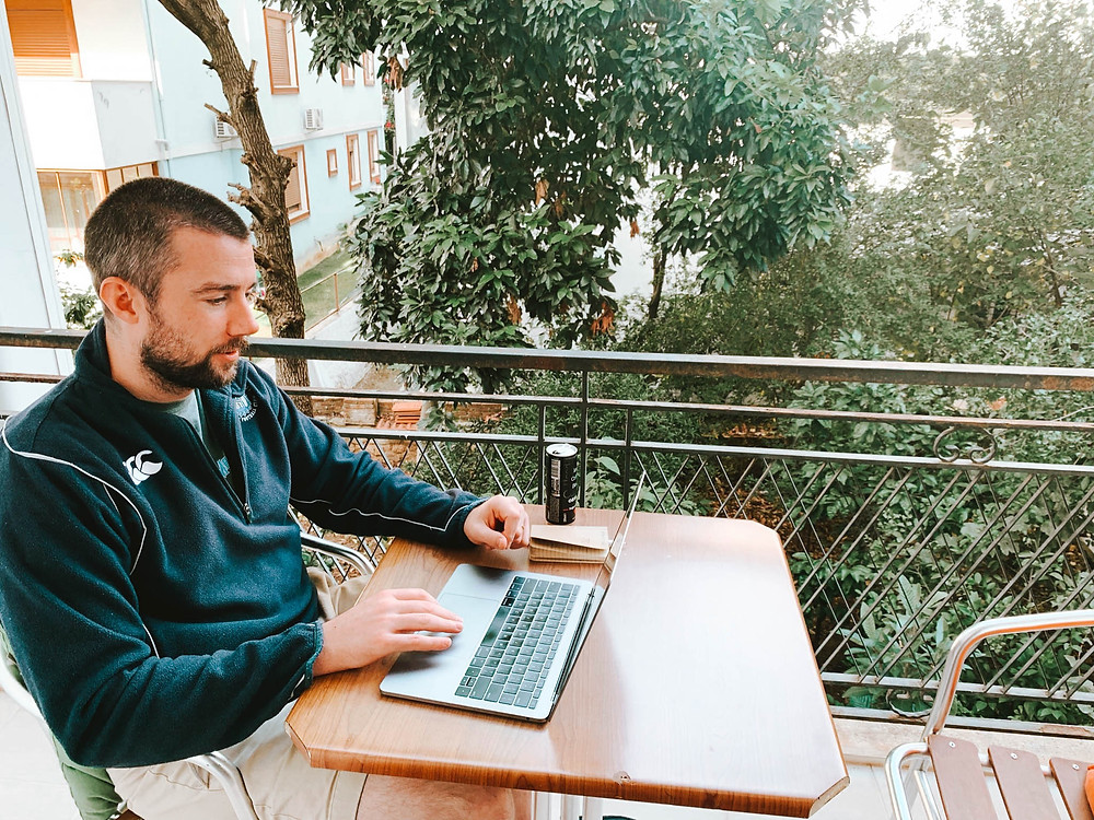 Working on our balcony over a beautiful backyard garden