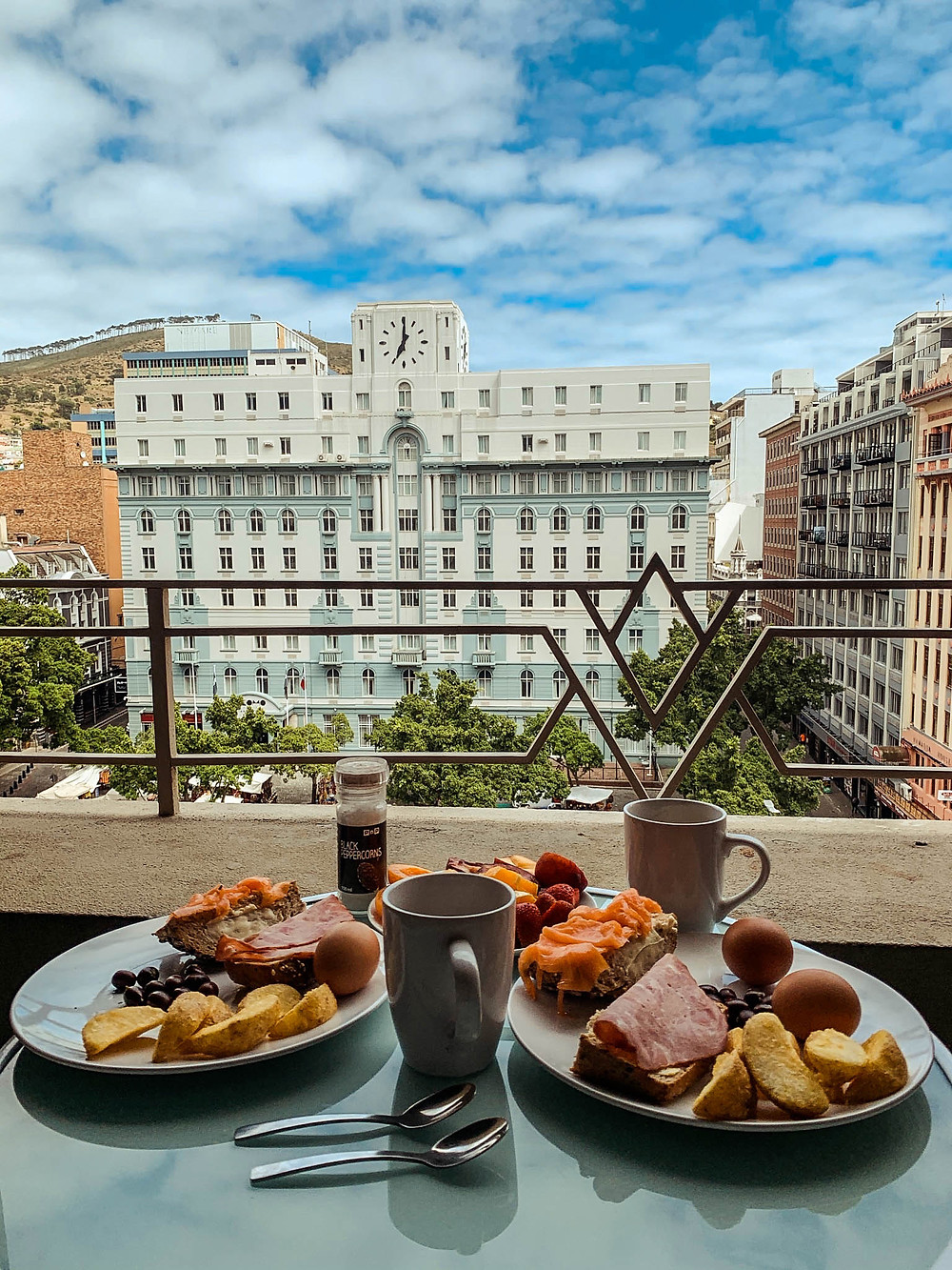 Breakfast on our apartment's balcony overlooking Greenmarket Square