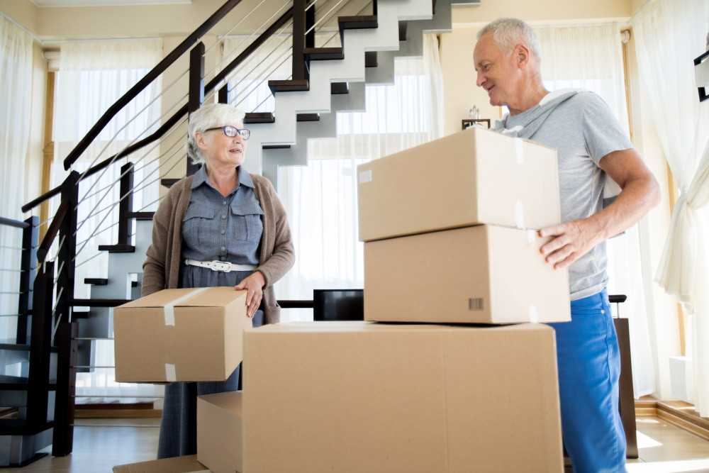 senior couple with moving boxes