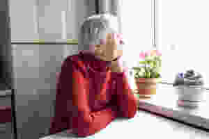 senior woman sitting at home