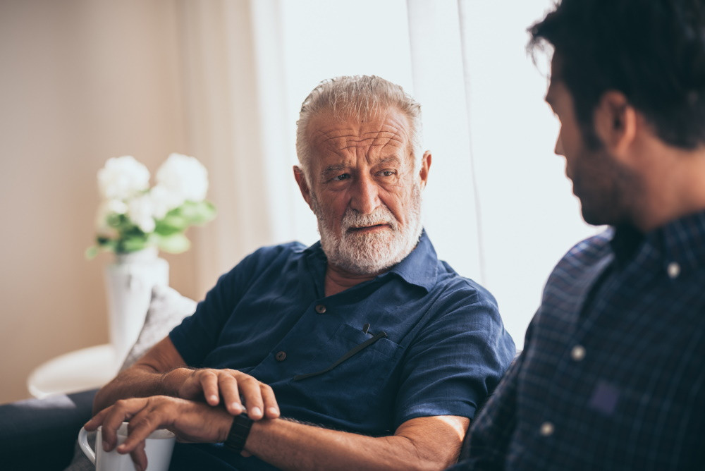 adult child discussing senior living communities with aging parent