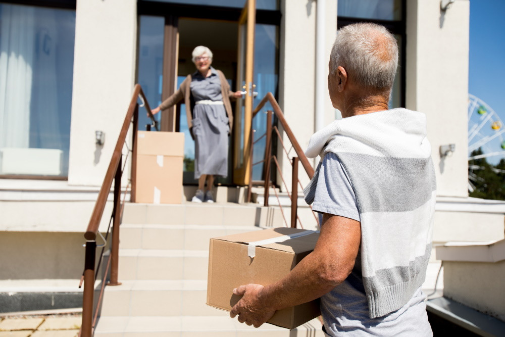 Senior couple with moving boxes