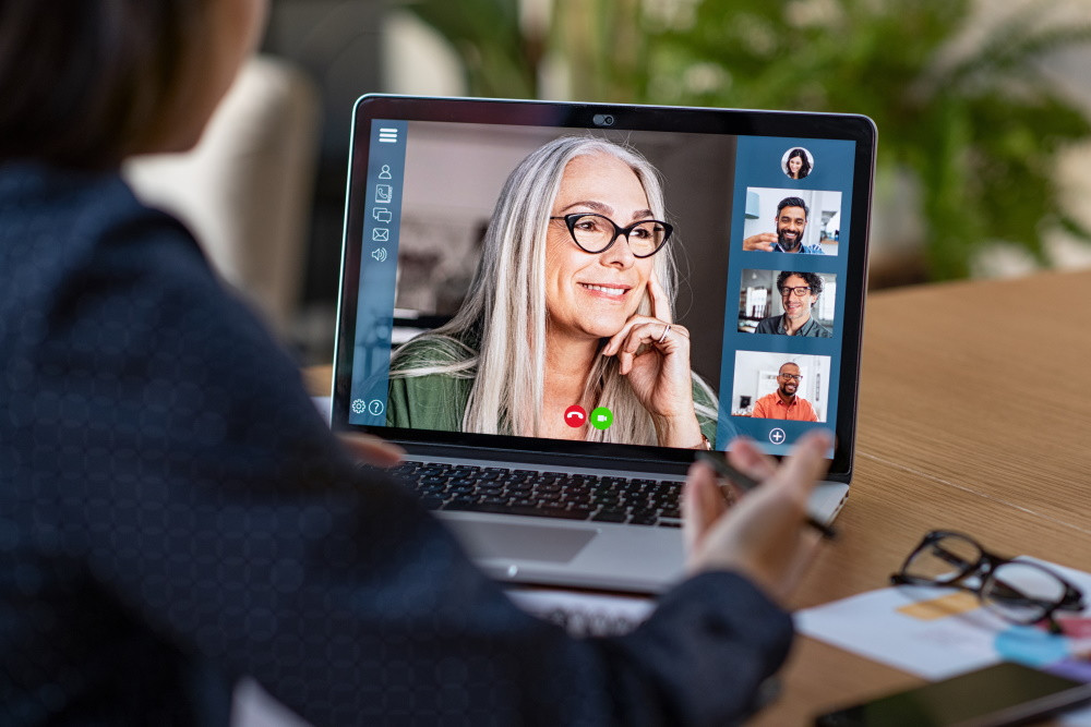 senior woman on group video conferencing screen