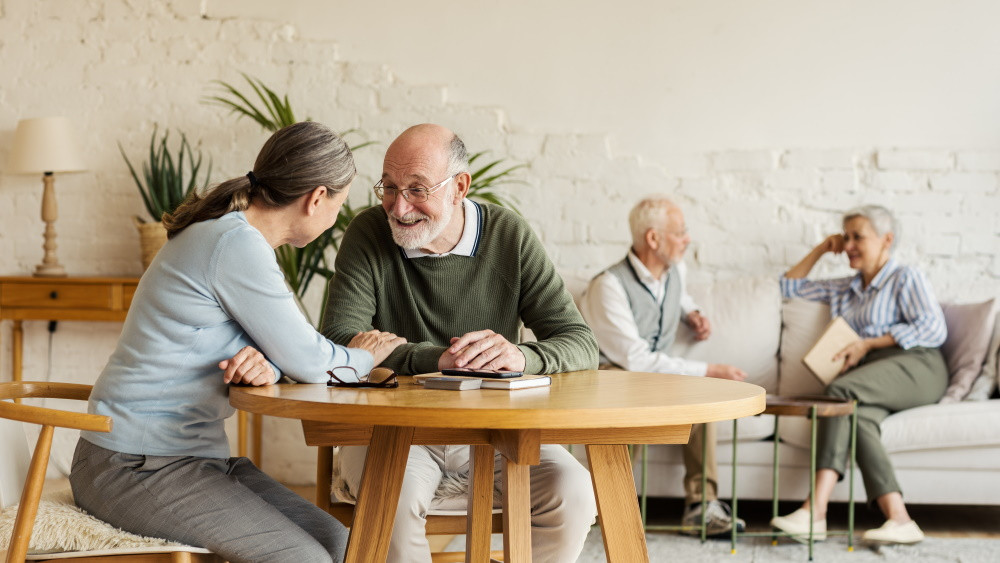 senior living community residents sitting at table