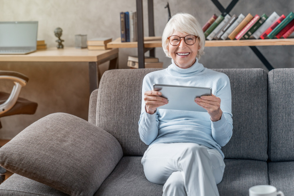 senior living resident holding ipad