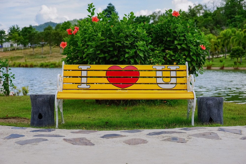 wooden bench with "I Heart You" painted on it
