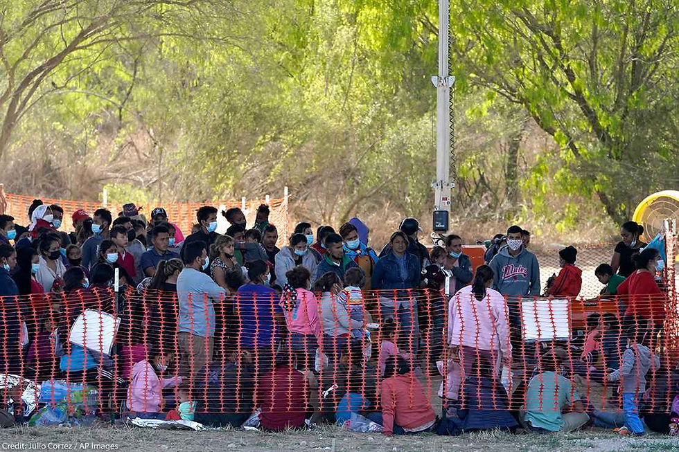 A group of people seeking asylum held in an outdoor site by Border Patrol in inhumane conditions.